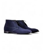 Navy blue suede chukka boots for men with a classic lace-up design.