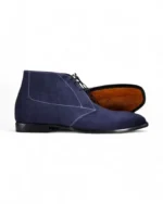 Navy blue suede chukka boots for men with a classic lace-up design.