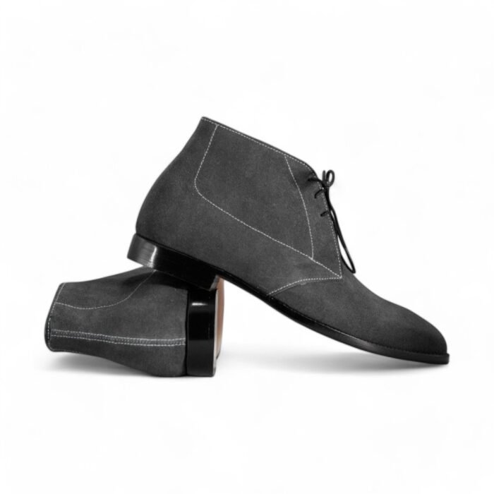 Grey suede chukka boots for men with a classic lace-up design.