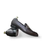 Durable water buffalo sole of Brown Anaconda Snake Print Penny Loafers, designed for traction and long-lasting performance.