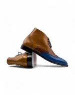 Men’s Three-Tone Wingtip Chukka Boots by Leather Edges, showcasing a handcrafted leather upper with intricate wingtip detailing.