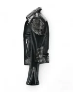 Side view of black leather jacket with silver spikes on shoulders and sleeves.