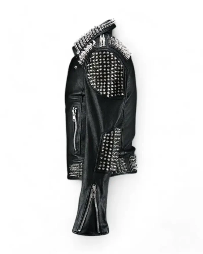 Side view of black leather jacket with silver spikes on shoulders and sleeves.