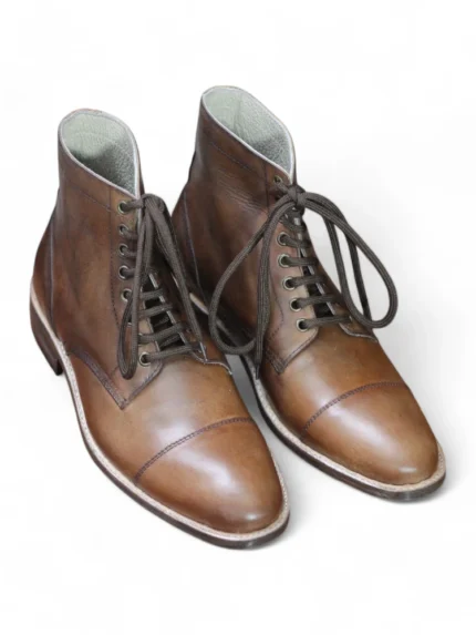 Close-up of lacing and eyelets on Cap-Toe Oxford Dress Boot.