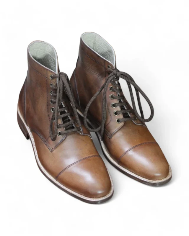 Close-up of lacing and eyelets on Cap-Toe Oxford Dress Boot.